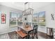 Charming dining area with natural light, wooden table, and views of the neighborhood at 7901 Apalachee Dr, Indianapolis, IN 46217