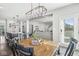 Bright dining area with a view of the kitchen, and an adjacent living space at 7901 Apalachee Dr, Indianapolis, IN 46217