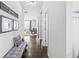 Bright entryway with hardwood floors leading to a cozy living area with lots of natural light at 7901 Apalachee Dr, Indianapolis, IN 46217