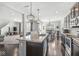 Open-concept kitchen featuring stainless steel appliances, granite countertops, and a large island perfect for entertaining at 7901 Apalachee Dr, Indianapolis, IN 46217