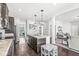 Bright and spacious kitchen with an island, stainless appliances, and an open layout flowing into the living area at 7901 Apalachee Dr, Indianapolis, IN 46217