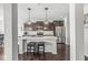 Stylish kitchen showcasing a large island, stainless steel appliances, and modern pendant lighting at 7901 Apalachee Dr, Indianapolis, IN 46217