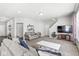 Spacious living room featuring plush carpeting, a staircase, and plenty of room for relaxation at 7901 Apalachee Dr, Indianapolis, IN 46217