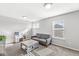 Inviting living room with modern furniture, a window, and ample space, creating a comfortable and stylish atmosphere at 7901 Apalachee Dr, Indianapolis, IN 46217