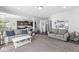 Open living area connecting to kitchen, featuring comfortable seating and bright natural light at 7901 Apalachee Dr, Indianapolis, IN 46217