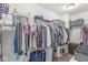 Spacious walk-in closet featuring ample hanging storage and shelving for optimal organization at 7901 Apalachee Dr, Indianapolis, IN 46217