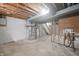 Utility area in the basement with exposed pipes, water heater and furnace at 8116 Cheswick Dr, Indianapolis, IN 46219