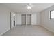 Bright bedroom featuring a ceiling fan, carpeted floors, and ample closet space at 8116 Cheswick Dr, Indianapolis, IN 46219