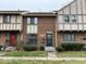 Brick townhome featuring a well-manicured lawn, front door, and decorative windows at 8116 Cheswick Dr, Indianapolis, IN 46219