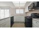Updated kitchen featuring modern appliances, ample cabinet space, and laminate countertops at 8116 Cheswick Dr, Indianapolis, IN 46219