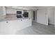 Open kitchen features modern appliances, generous counter space, and laminate flooring at 8116 Cheswick Dr, Indianapolis, IN 46219