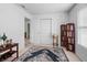 Well-lit bedroom featuring a rug, decorative bookcase, and ample natural light at 853 Westpointe Dr, Shelbyville, IN 46176