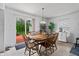 Comfortable dining room features a wooden table with seating for six and sliding door access to a deck at 853 Westpointe Dr, Shelbyville, IN 46176