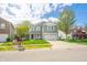 Beautiful two-story home with a well-kept lawn, mature trees, and a welcoming front porch in a quiet neighborhood at 853 Westpointe Dr, Shelbyville, IN 46176