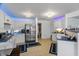 Spacious kitchen featuring blue countertops, white cabinets, stainless steel appliances and tile flooring at 853 Westpointe Dr, Shelbyville, IN 46176