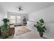 Spacious living area featuring neutral carpet and a comfortable seating area near bright windows at 853 Westpointe Dr, Shelbyville, IN 46176