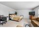 Relaxing bedroom with a neutral color palette, a queen-size bed, and a cozy seating area at 853 Westpointe Dr, Shelbyville, IN 46176