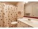 Traditional bathroom with a neutral shower curtain, mirror, and vanity at 8618 Turnstone Ct, Indianapolis, IN 46234
