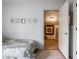 Bright bedroom featuring doorway to walk-in closet and carpeted floor at 8618 Turnstone Ct, Indianapolis, IN 46234