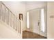 Bright foyer with a staircase, neutral flooring, and a pristine white front door that enhances the welcoming ambiance at 8618 Turnstone Ct, Indianapolis, IN 46234