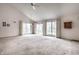 Spacious living room with a high ceiling and big windows provides natural light and an airy feel to the home at 8618 Turnstone Ct, Indianapolis, IN 46234