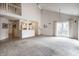 Open-concept living room showcases a lofted space, natural light, and seamless flow into the modern kitchen at 8618 Turnstone Ct, Indianapolis, IN 46234