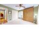 Neutral bedroom with a Murphy bed, closet, ceiling fan, and a serene atmosphere at 8842 Rocky Ridge Rd, Indianapolis, IN 46217