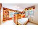 Charming bedroom featuring built-in bunk beds and shelving, perfect for storage and play at 8842 Rocky Ridge Rd, Indianapolis, IN 46217
