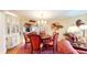 Formal dining room boasts a round wood table with red chairs and a decorative rug at 8842 Rocky Ridge Rd, Indianapolis, IN 46217
