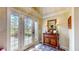 Entryway with decorative doors and trim, and a beautiful wooden console at 8842 Rocky Ridge Rd, Indianapolis, IN 46217