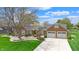 Beautiful brick home with a two-car garage and mature landscaping at 8842 Rocky Ridge Rd, Indianapolis, IN 46217