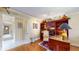 Bright home office features built-in desk, shelving, and comfortable chair at 8842 Rocky Ridge Rd, Indianapolis, IN 46217