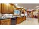 Classic kitchen with wood cabinets, tile backsplash, and modern appliances at 8842 Rocky Ridge Rd, Indianapolis, IN 46217