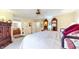 Comfortable main bedroom with a large bed, ample closet space, and access to an ensuite bathroom at 8842 Rocky Ridge Rd, Indianapolis, IN 46217