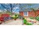 Inviting patio with decorative benches, manicured bushes, and lush plants offering a relaxing outdoor space at 8842 Rocky Ridge Rd, Indianapolis, IN 46217