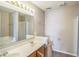Spacious bathroom featuring double sinks with wood cabinets and a large mirror at 8888 N White Tail N Trl, McCordsville, IN 46055