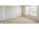 Neutral bedroom featuring bright natural light, light carpet, and white trim at 8888 N White Tail N Trl, McCordsville, IN 46055