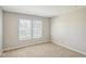 Neutral bedroom features two windows with blinds and carpet flooring at 8888 N White Tail N Trl, McCordsville, IN 46055