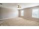 Bright bedroom with a ceiling fan, two windows, and neutral carpet at 8888 N White Tail N Trl, McCordsville, IN 46055