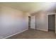A carpeted bedroom features a closet and neutral color scheme at 8888 N White Tail N Trl, McCordsville, IN 46055