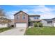 Charming two-story home featuring a brick and siding facade, attached two car garage, and a well manicured front lawn at 8888 N White Tail N Trl, McCordsville, IN 46055
