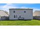Backyard view of the home featuring a deck and well-maintained lawn at 8888 N White Tail N Trl, McCordsville, IN 46055