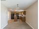 Cozy kitchen featuring oak cabinets, black appliances, a center island, and neutral paint at 8888 N White Tail N Trl, McCordsville, IN 46055