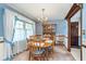 Charming dining room with wooden table and chairs with light blue accents at 990 Broadway N Dr, Plainfield, IN 46168