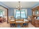 Bright dining room with traditional furniture and a decorative chandelier at 990 Broadway N Dr, Plainfield, IN 46168