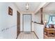 Inviting entryway with tile floors, wallpaper, and white front door at 990 Broadway N Dr, Plainfield, IN 46168