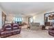 Spacious living room with comfortable furniture and access to the kitchen at 990 Broadway N Dr, Plainfield, IN 46168