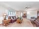 Cozy living room with carpet, a ceiling fan, and classic furnishings at 990 Broadway N Dr, Plainfield, IN 46168