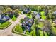 Aerial view of a brick house on a well-manicured lawn in a lush neighborhood at 10715 Hamilton Pass, Fishers, IN 46037