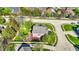 Aerial view of a home featuring a backyard deck, privacy fence, and mature trees at 10715 Hamilton Pass, Fishers, IN 46037